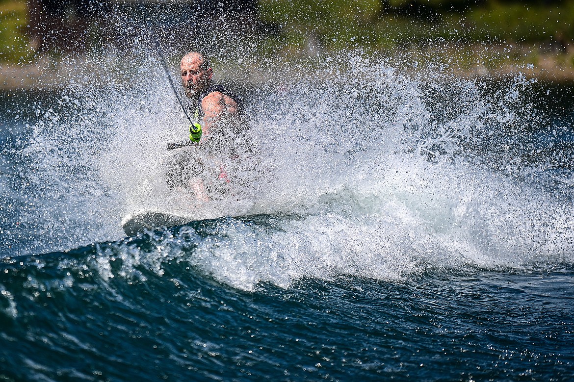 Erik Barnes carves across a boat's wake on an adaptive water ski during DREAM Adaptive Recreation's Echo Lake Watersports Days on Tuesday, July 16. (Casey Kreider/Daily Inter Lake)