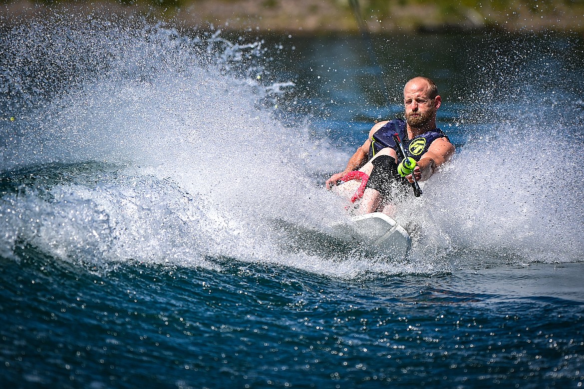 Erik Barnes carves across a boat's wake on an adaptive water ski during DREAM Adaptive Recreation's Echo Lake Watersports Days on Tuesday, July 16. (Casey Kreider/Daily Inter Lake)