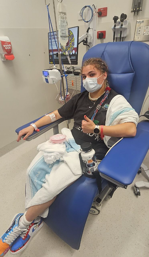 Incoming Coeur d'Alene High senior Mari Nelson gives a thumbs up from a hospital in New South Wales, Australia as she is treated for a stomach illness July 10, two days before she competed in an international track meet. She still managed to place sixth overall in the 60-meter race, ninth in the 100-meter race and third in the relay.