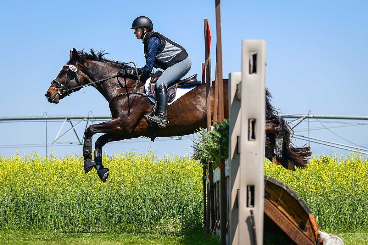 A rider clears a jump as she practices steeplechase along the course prior to The Event at Rebecca Farm on Wednesday, July 17. (Casey Kreider/Daily Inter Lake)