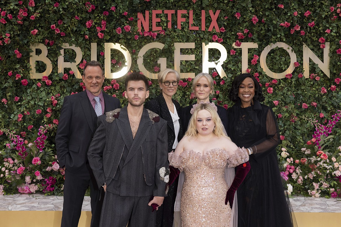 Tom Verica, Luke Newton, Betsy Beers, Bridgerton, Jess Brownell, Nicola Coughlan and Shonda Rhimes pose for photographers upon arrival at the season three part two screening of the television series 'Bridgerton', in London, Wednesday, June 12, 2024. (Photo by Vianney Le Caer/Invision/AP)