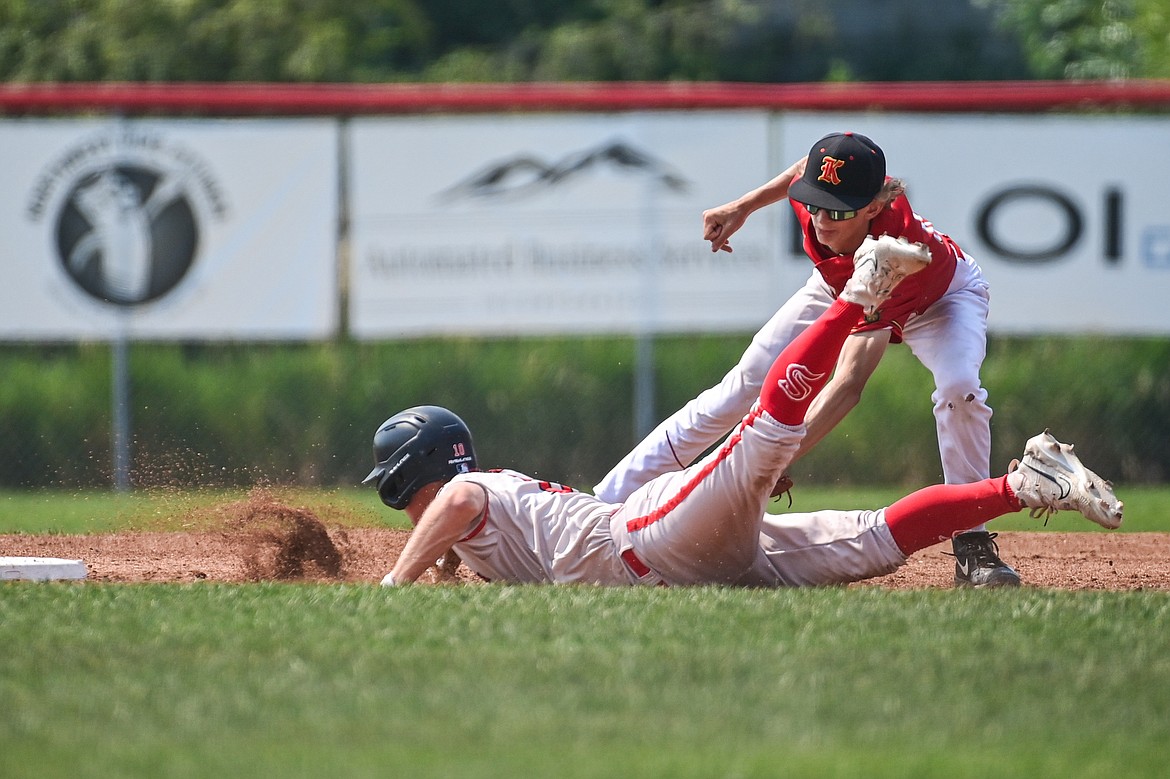 Lakers AA shortstop Kaden Drish (6) puts the tag on a Billings Scarlet runner who was called safe at second base at Griffin Field on Thursday, July 18. (Casey Kreider/Daily Inter Lake)