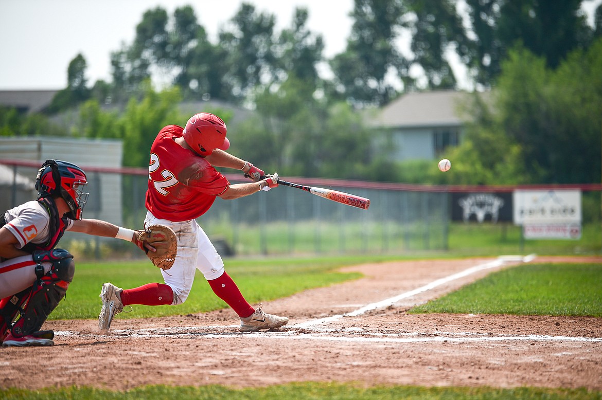 Kalispell's Trever Cockerill (22) connects against the Billings Scarlets at Griffin Field on Thursday, July 18. (Casey Kreider/Daily Inter Lake)