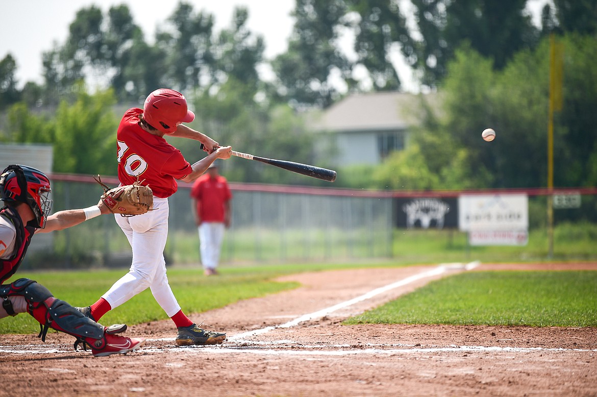 Kalispell's Ostyn Brennan (10) connects in the first inning against the Billings Scarlets at Griffin Field on Thursday, July 18. (Casey Kreider/Daily Inter Lake)