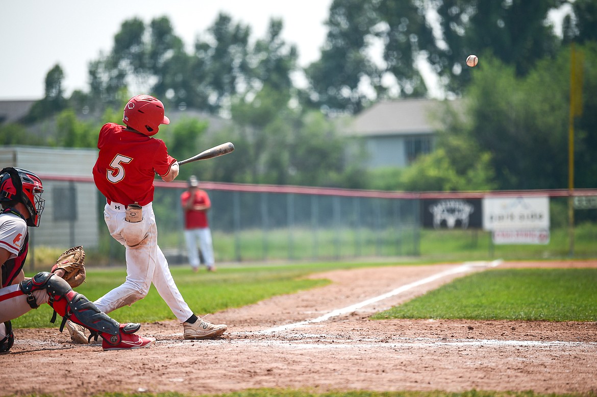 Kalispell's Carter Schlegel (5) connects on a single against the Billings Scarlets at Griffin Field on Thursday, July 18. (Casey Kreider/Daily Inter Lake)