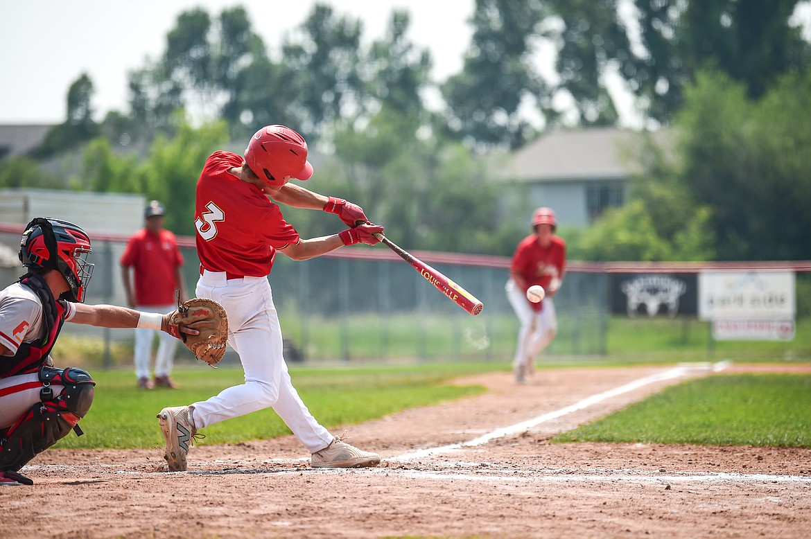 Kalispell's Oscar Kallis (3) drives in two runs with a bases-loaded single against the Billings Scarlets at Griffin Field on Thursday, July 18. (Casey Kreider/Daily Inter Lake)