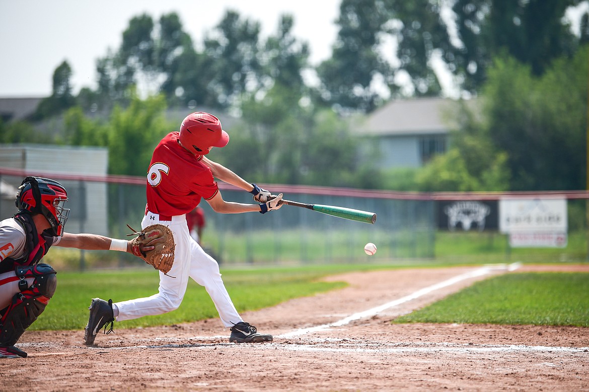 Kalispell's Kaden Drish (6) connects on a single against the Billings Scarlets at Griffin Field on Thursday, July 18. (Casey Kreider/Daily Inter Lake)