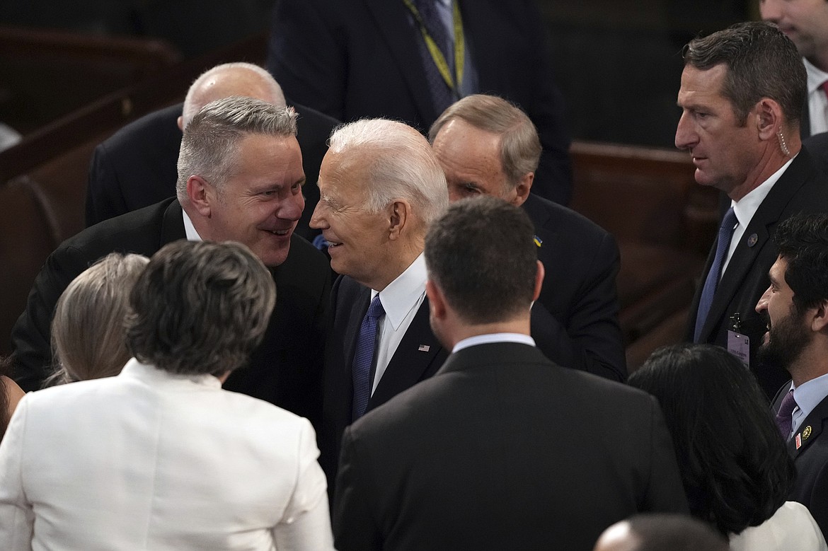 President Joe Biden talks with Sen. Jon Tester, D-Mont., after delivering the State of the Union address to a joint session of Congress at the U.S. Capitol, Thursday March 7, 2024, in Washington. (AP Photo/Andrew Harnik)