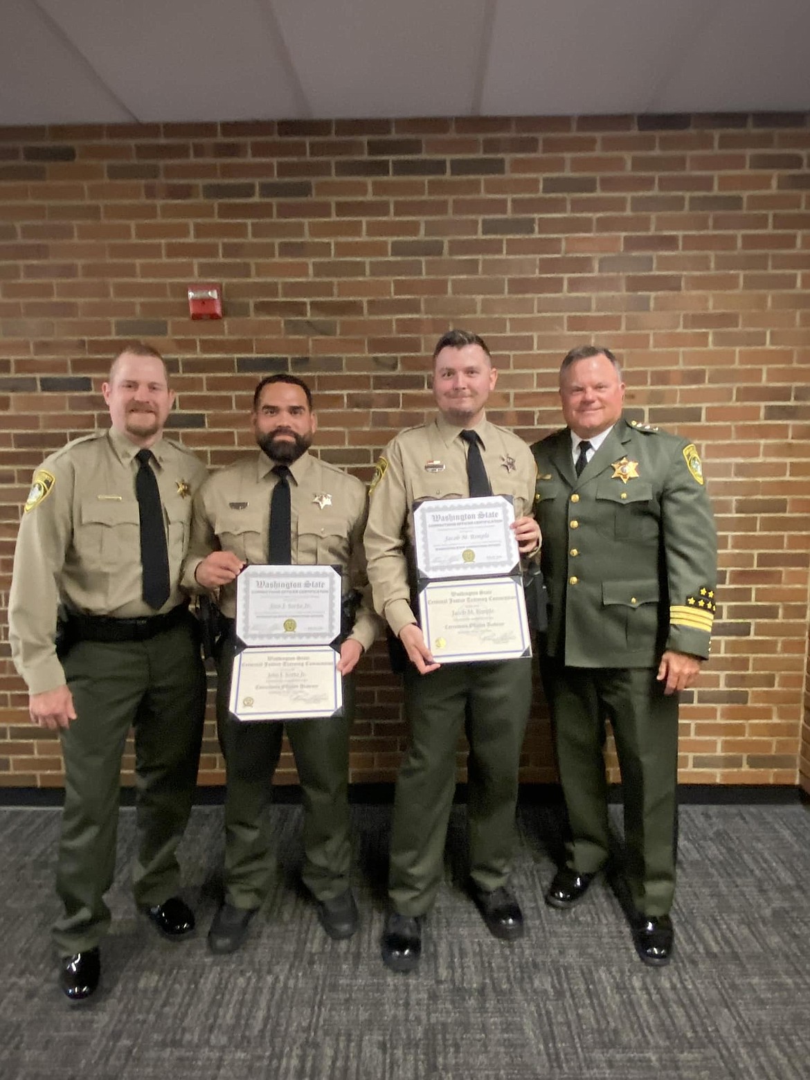 Grant County Sheriff Joey Kriete, right, attended the Basic Corrections Officers Academy graduation Thursday to welcome deputies Jose Sorto, second from left, and Jacob Rimple, second from right, as they graduated from the academy. On the left is Sgt. Seth Hinkel.