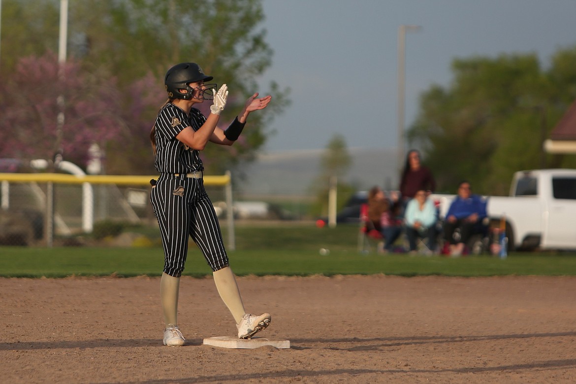 Jill Allred celebrates on second base after hitting a double during a game in the 2023 season. Allred has started for the Knights for each of her first two Royal softball seasons.