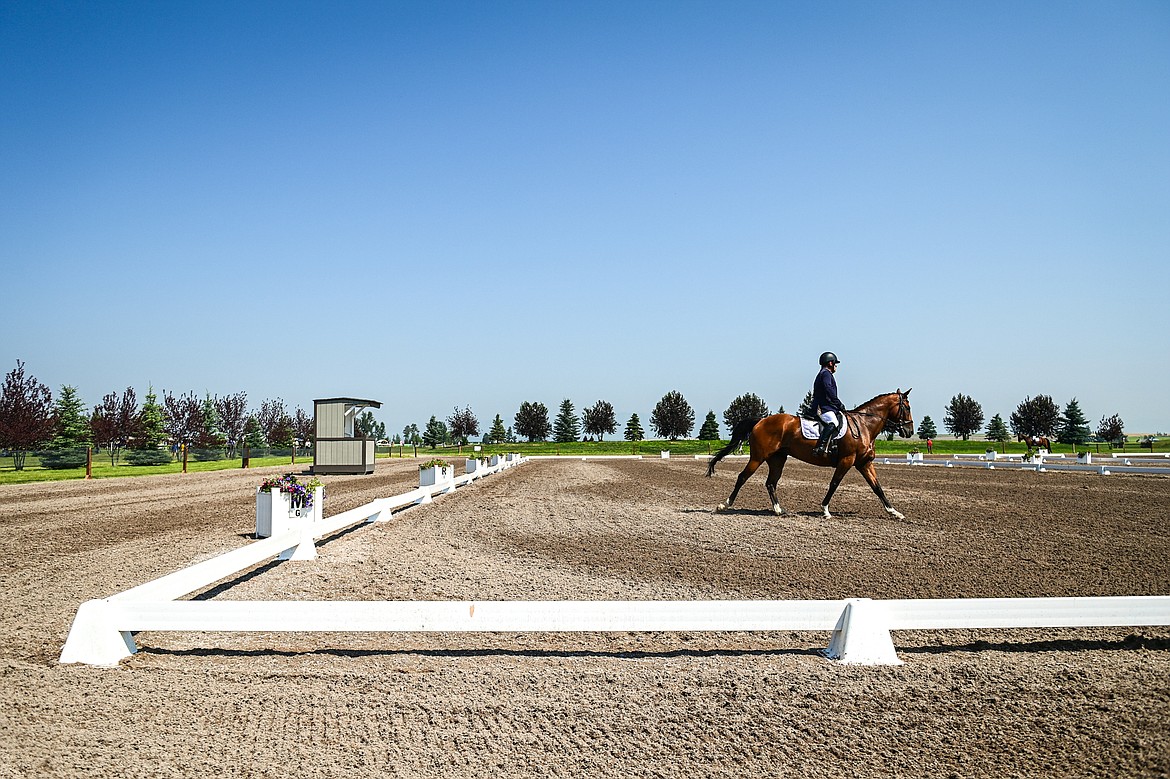 Reed Ayers rides Peanut around the arena during Open Preliminary A dressage at The Event at Rebecca Farm on Friday, July 19. (Casey Kreider/Daily Inter Lake)