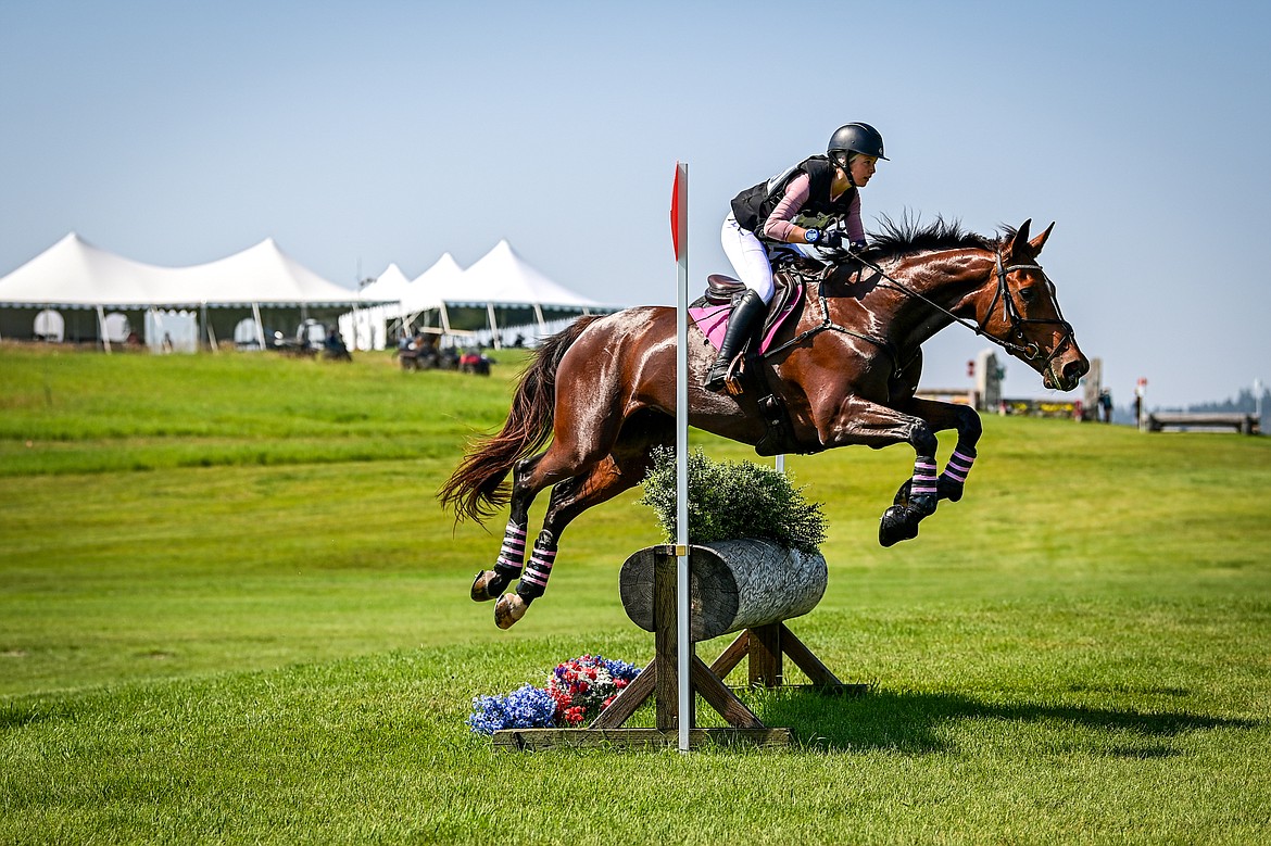 Emma Slocum rides Patito over a jump during Training Three-Day cross-country at The Event at Rebecca Farm on Friday, July 19. (Casey Kreider/Daily Inter Lake)