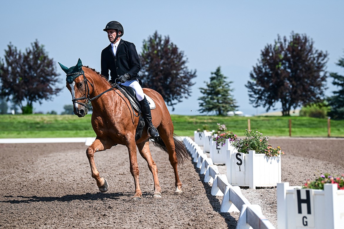 Chris Kawcak rides Amelie around the arena during Open Preliminary B dressage at The Event at Rebecca Farm on Friday, July 19. (Casey Kreider/Daily Inter Lake)