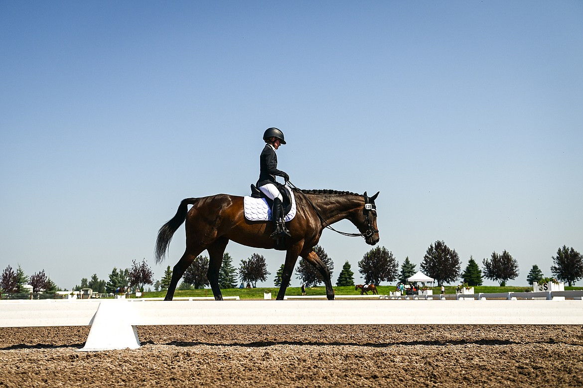 Ashley Widmer rides Machtig Maus around the arena during Open Preliminary A dressage at The Event at Rebecca Farm on Friday, July 19. (Casey Kreider/Daily Inter Lake)