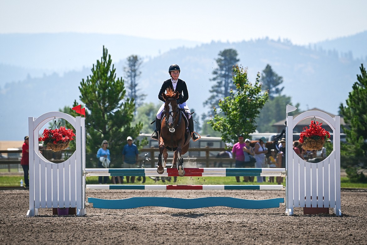 Xanthe Hailey rides Glinda Good Witch over a jump during Junior Open Novice A show jumping at The Event at Rebecca Farm on Friday, July 19. (Casey Kreider/Daily Inter Lake)