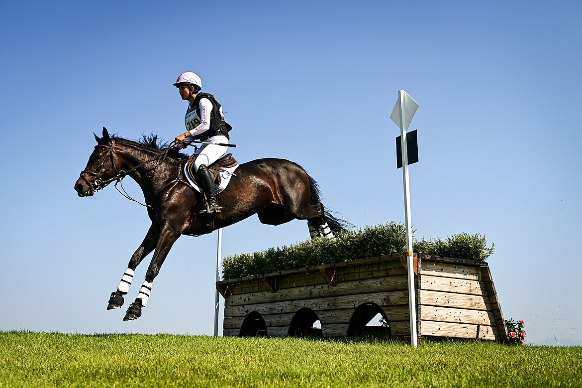 Lauren Hsieh rides Happy Prospect over a jump on the course during Training Three-Day cross-country at The Event at Rebecca Farm on Friday, July 19. (Casey Kreider/Daily Inter Lake)