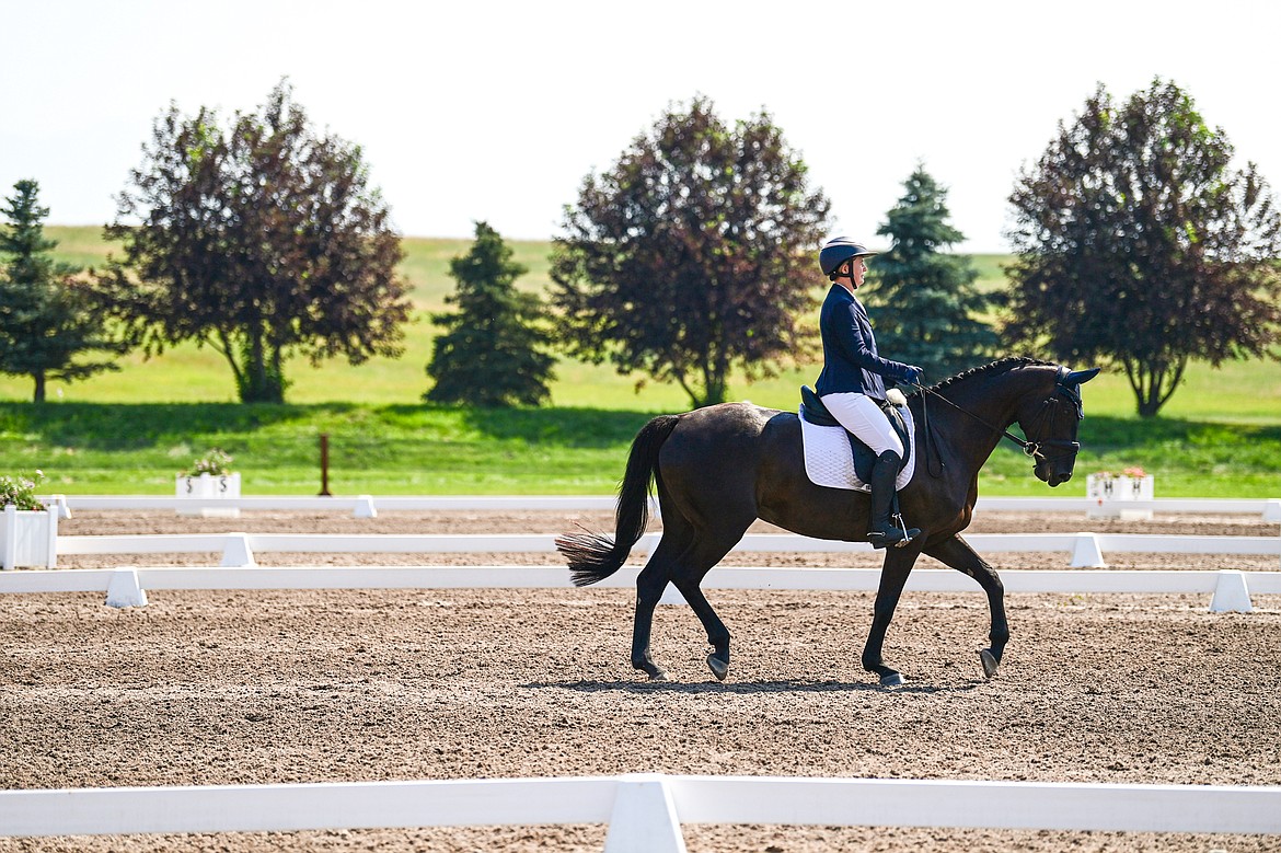 Grace Brownrigg rides Dhaulagiri around the arena during Open Preliminary A dressage at The Event at Rebecca Farm on Friday, July 19. (Casey Kreider/Daily Inter Lake)