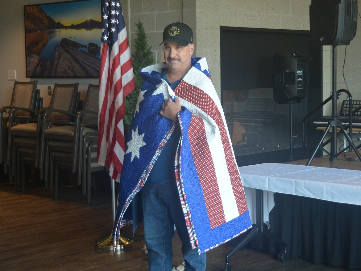 Dale Coler, a veteran and staff member at Idaho State Veterans Home Post Falls receives his Quilt of Honor.