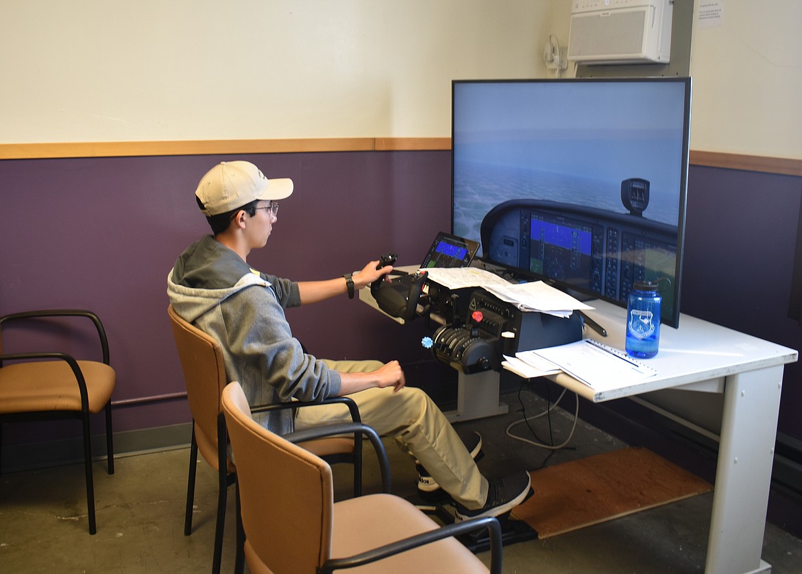 A Civil Air Patrol cadet practices on a simulator at the National Flight Academy Thursday.