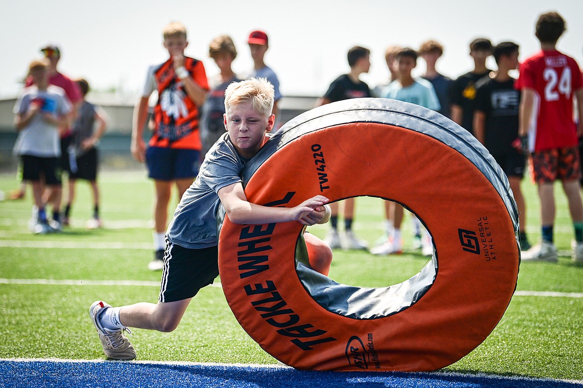 Campers run a tackling drill at the Flathead Braves Football Camp hosted by former NFL and Flathead Braves quarterback Brock Osweiler at Legends Stadium on Saturday, July 20. (Casey Kreider/Daily Inter Lake)