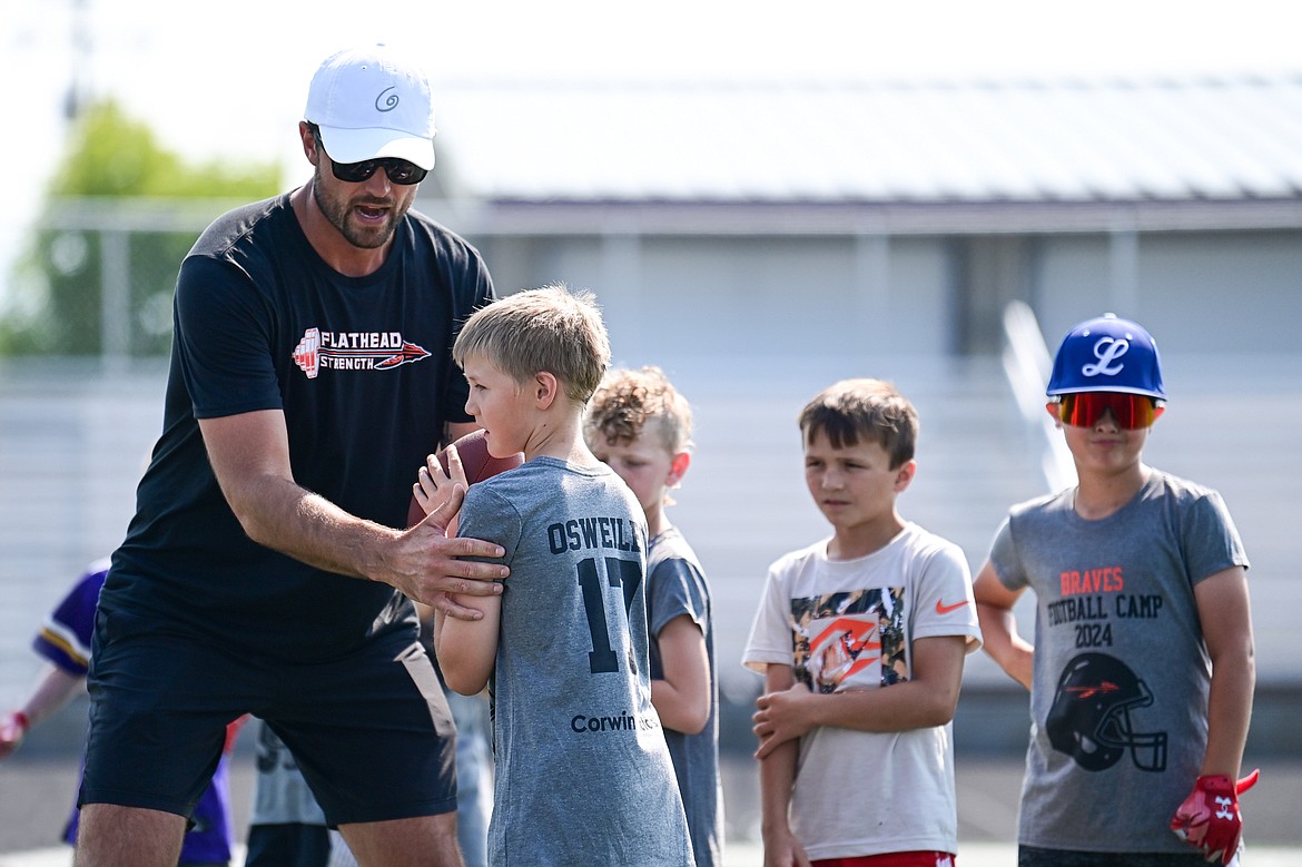 Former NFL and Flathead Braves quarterback Brock Osweiler runs a drill with campers at the Flathead Braves Football Camp at Legends Stadium on Saturday, July 20. (Casey Kreider/Daily Inter Lake)