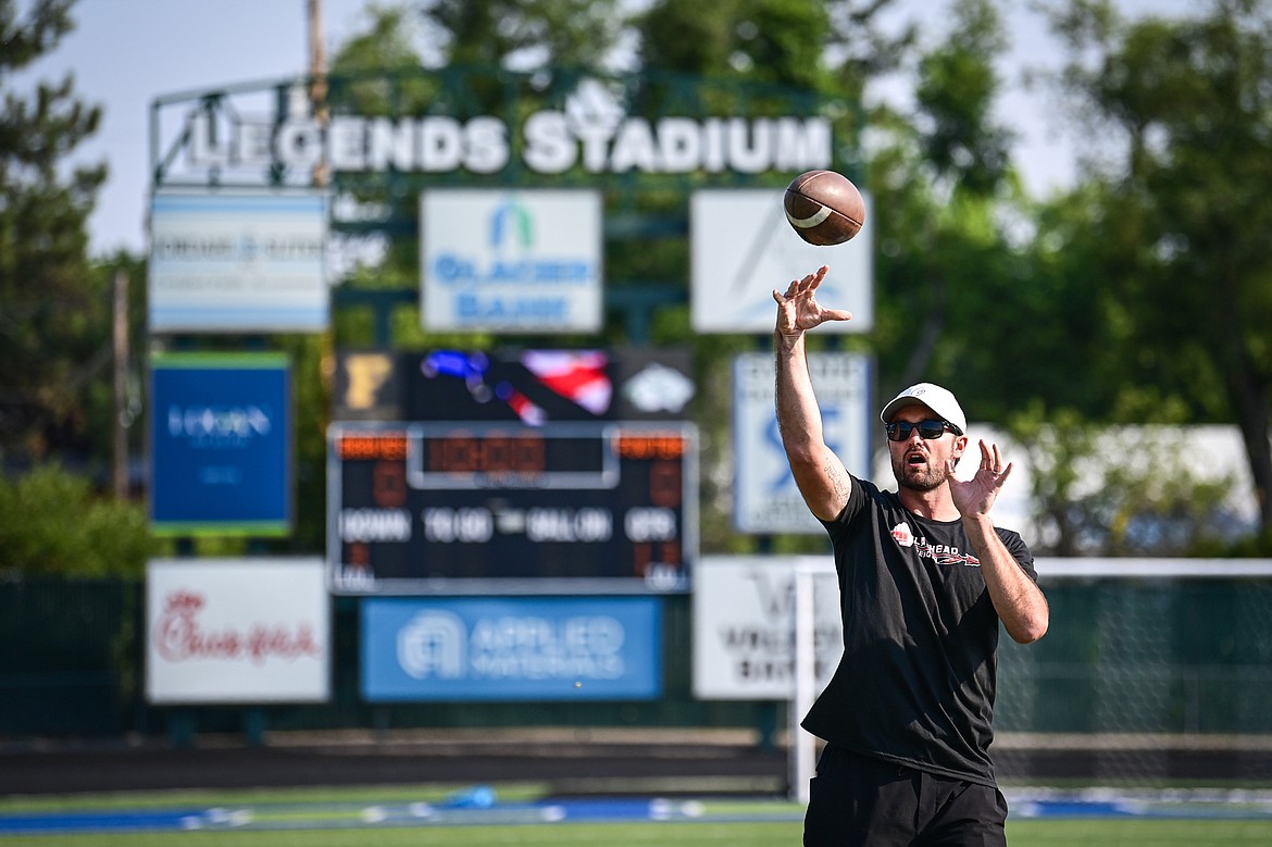 Former NFL and Flathead Braves quarterback Brock Osweiler throws a football to campers during a drill at the Flathead Braves Football Camp at Legends Stadium on Saturday, July 20. (Casey Kreider/Daily Inter Lake)