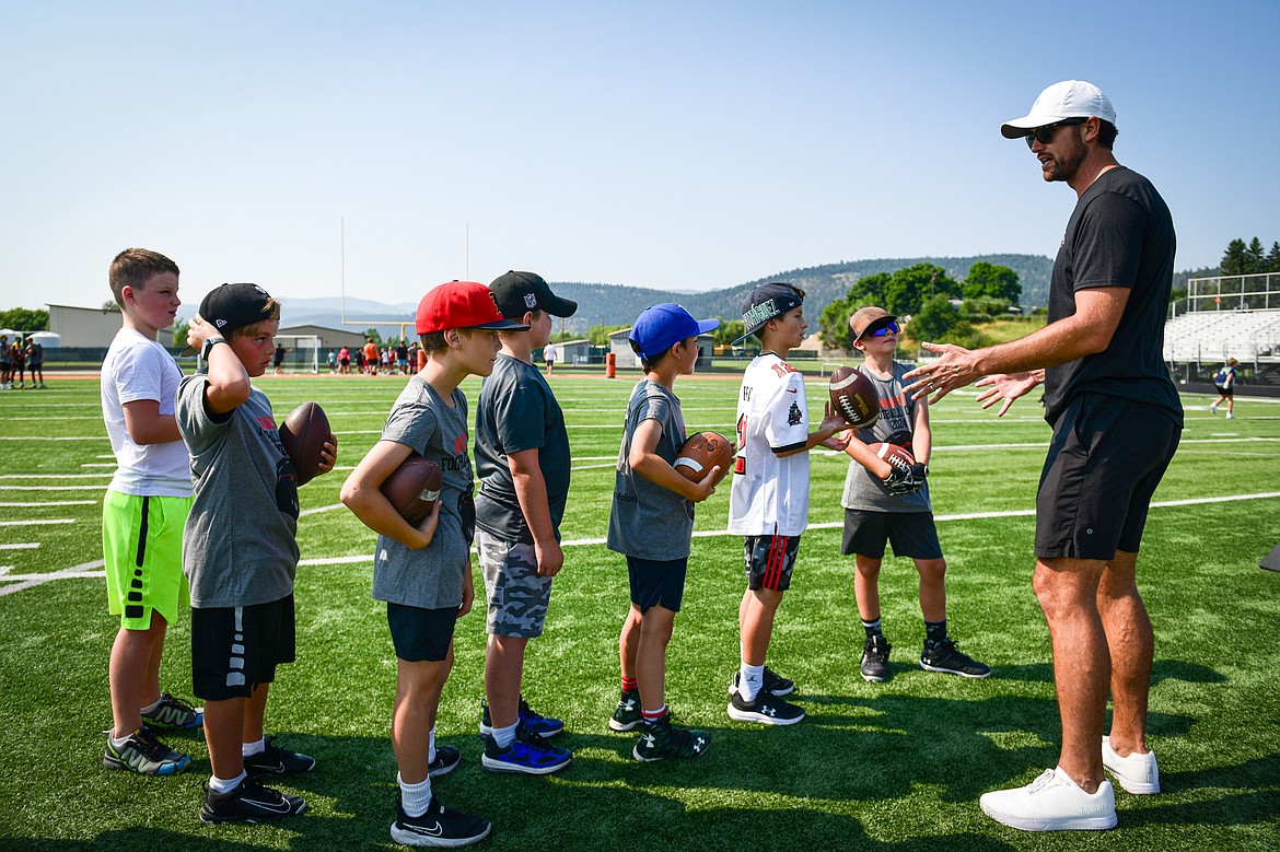 Former NFL and Flathead Braves quarterback Brock Osweiler runs a drill with campers at the Flathead Braves Football Camp at Legends Stadium on Saturday, July 20. (Casey Kreider/Daily Inter Lake)