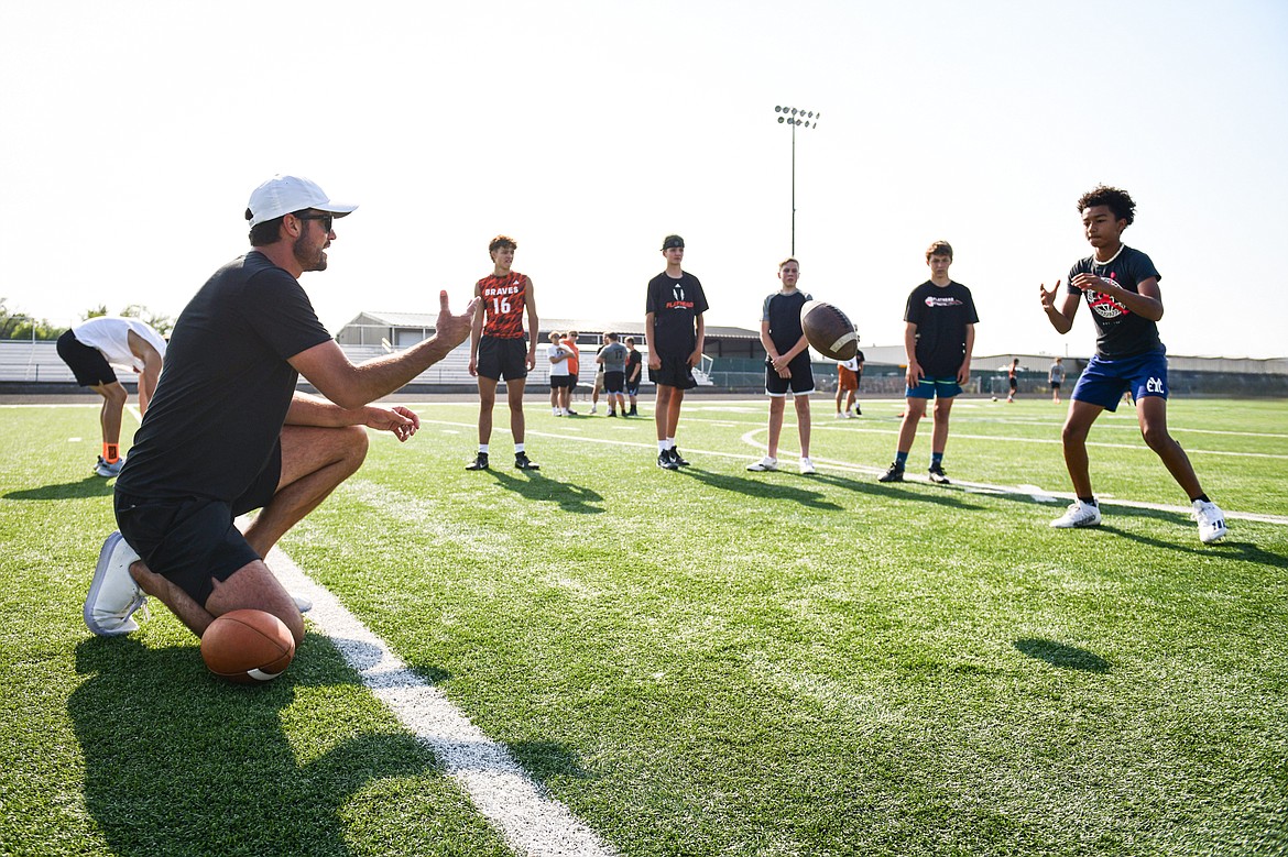 Former NFL and Flathead Braves quarterback Brock Osweiler runs a drill with campers at the Flathead Braves Football Camp at Legends Stadium on Saturday, July 20. (Casey Kreider/Daily Inter Lake)