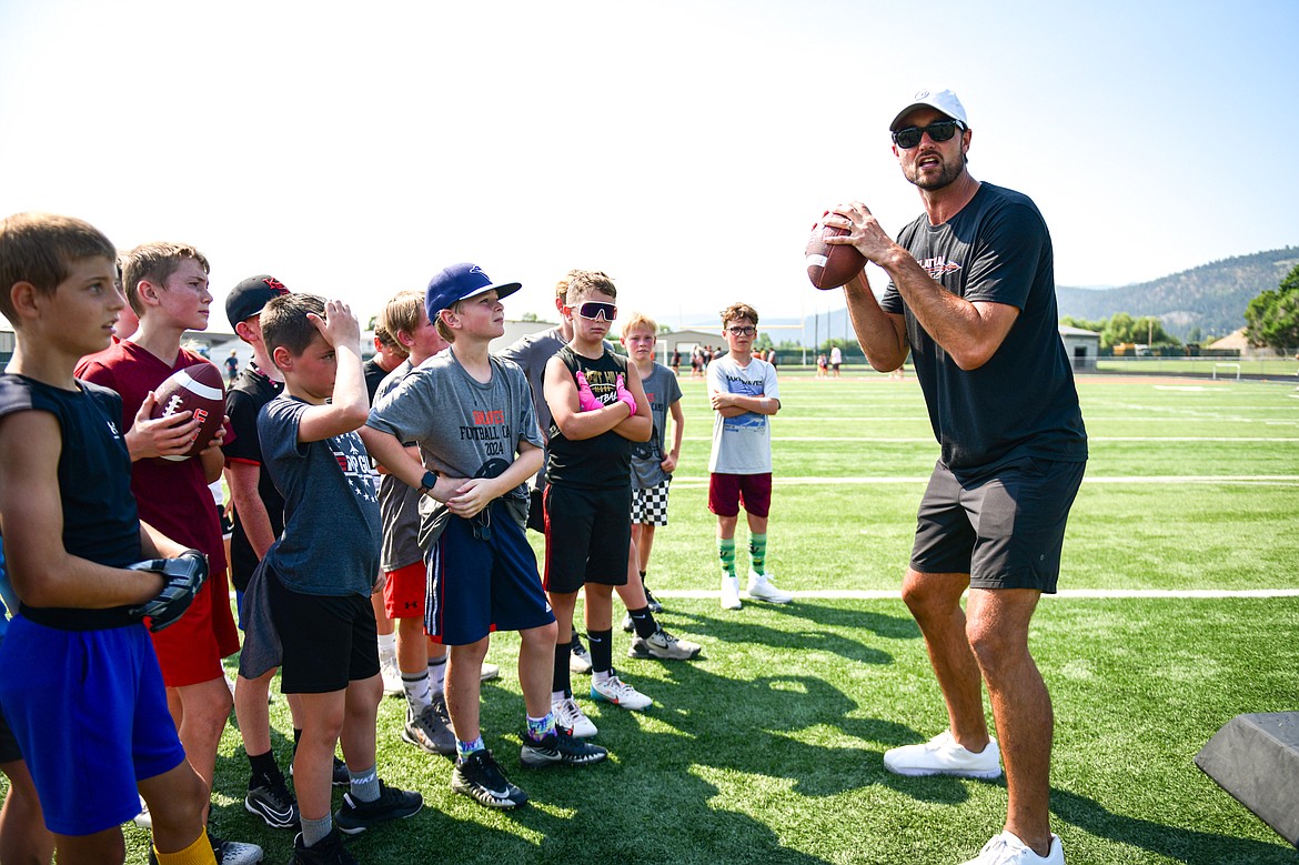 Former NFL and Flathead Braves quarterback Brock Osweiler runs a drill with campers at the Flathead Braves Football Camp at Legends Stadium on Saturday, July 20. (Casey Kreider/Daily Inter Lake)