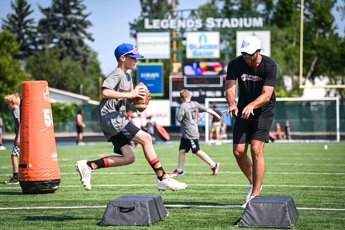 Former NFL and Flathead Braves quarterback Brock Osweiler runs a drill with campers at the Flathead Braves Football Camp at Legends Stadium on Saturday, July 20. (Casey Kreider/Daily Inter Lake)