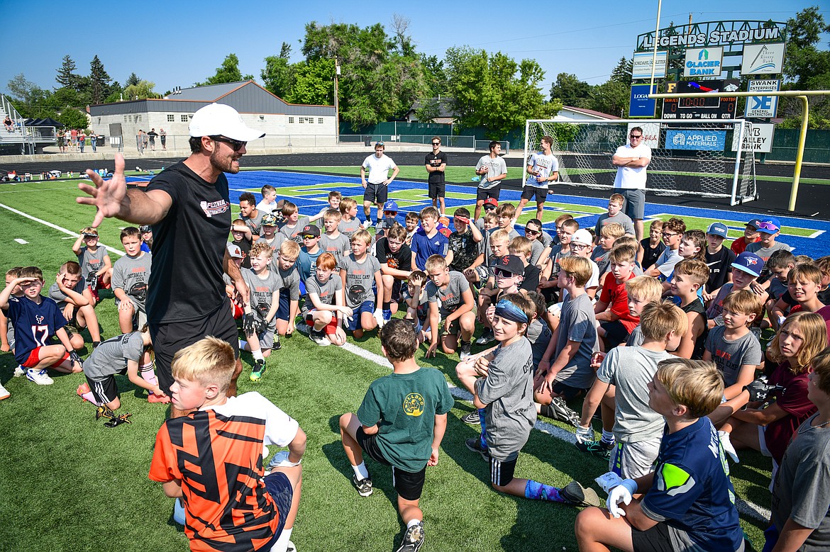 Former NFL and Flathead Braves quarterback Brock Osweiler speaks to campers during the Flathead Braves Football Camp at Legends Stadium on Saturday, July 20. (Casey Kreider/Daily Inter Lake)