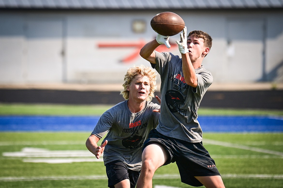 Campers run pass-catching and defending drills at the Flathead Braves Football Camp hosted by former NFL and Flathead Braves quarterback Brock Osweiler at Legends Stadium on Saturday, July 20. (Casey Kreider/Daily Inter Lake)