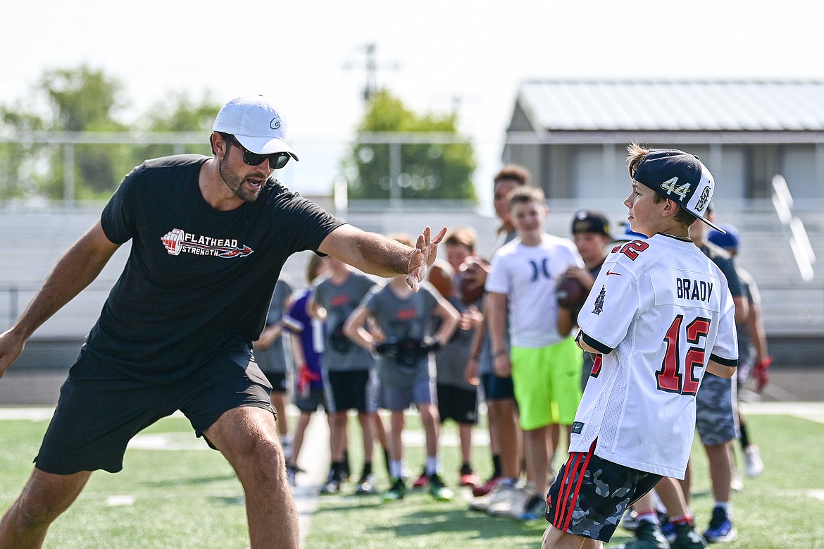 Former NFL and Flathead Braves quarterback Brock Osweiler plays defense during a quarterback drill at the Flathead Braves Football Camp at Legends Stadium on Saturday, July 20. (Casey Kreider/Daily Inter Lake)