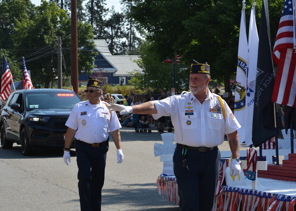 Ken Johnson waves at the crowd as he and Tim Chandler march in the Rathdrum Days parade.