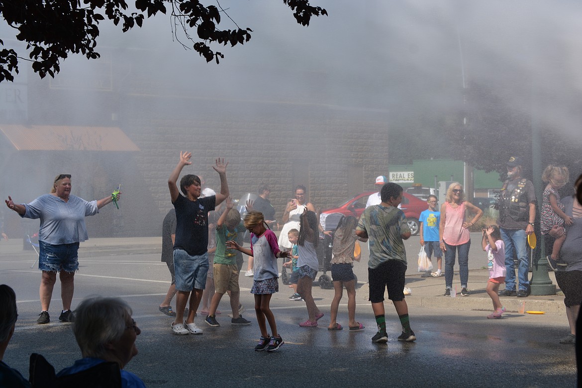 Hauser Lake Fire Department cools down the crowd at the Rathdrum Days Parade.