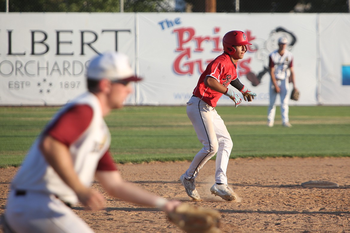 Red Raider center fielder Julian Ruiz, in red, leads off of second base during the top of the seventh inning against Walla Walla on Friday in Yakima.