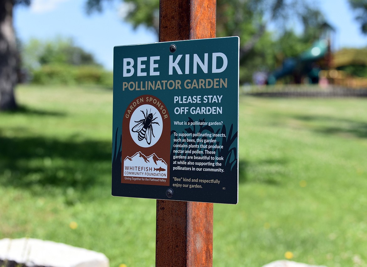 One of the new Bee Kind signs posted in city parks that includes information about pollinator gardens. (Julie Engler/Whitefish Pilot)