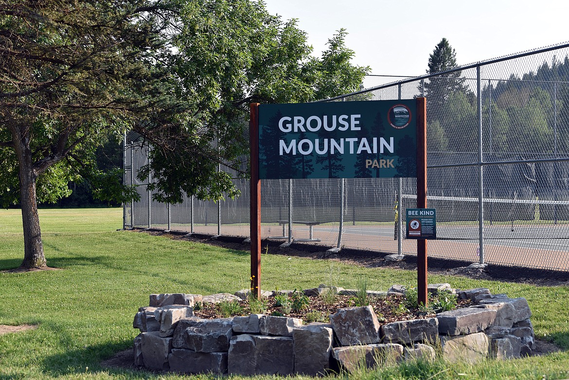 The new pollinator garden and park sign welcome visitors to Grouse Mountain Park. (Julie Engler/Whitefish Pilot)