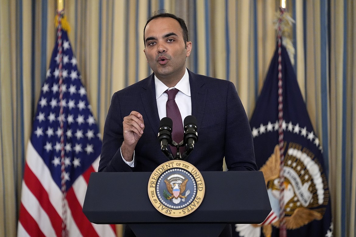 FILE - Rohit Chopra, director of the Consumer Financial Protection Bureau, speaks as President Joe Biden meets with his Competition Council to announce new actions to lower costs for families in the State Dining Room of the White House in Washington, on March 5, 2024. The CFPB said Thursday July 18, 2024 that apps that allow workers to access their paychecks in advance, often for a fee, are providing loans and should be subject to the Truth in Lending Act. (AP Photo/Andrew Harnik, File)