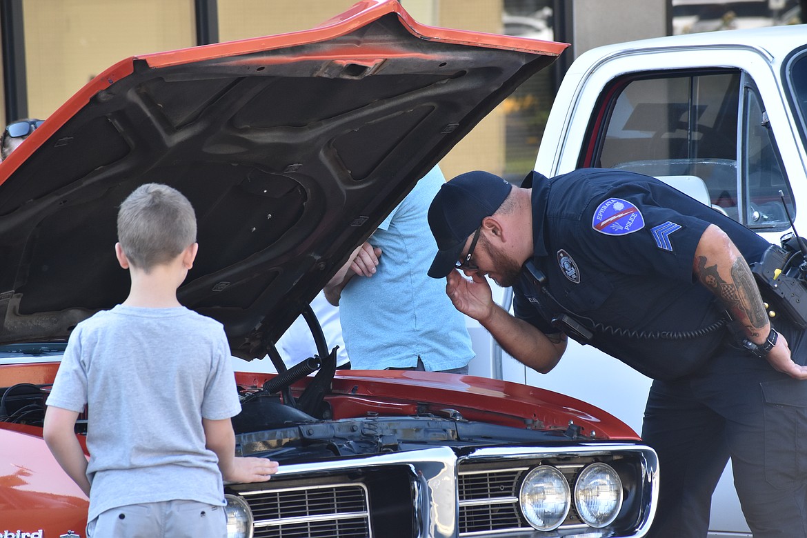 Many cars had their hoods up for spectators to get a close-up look.