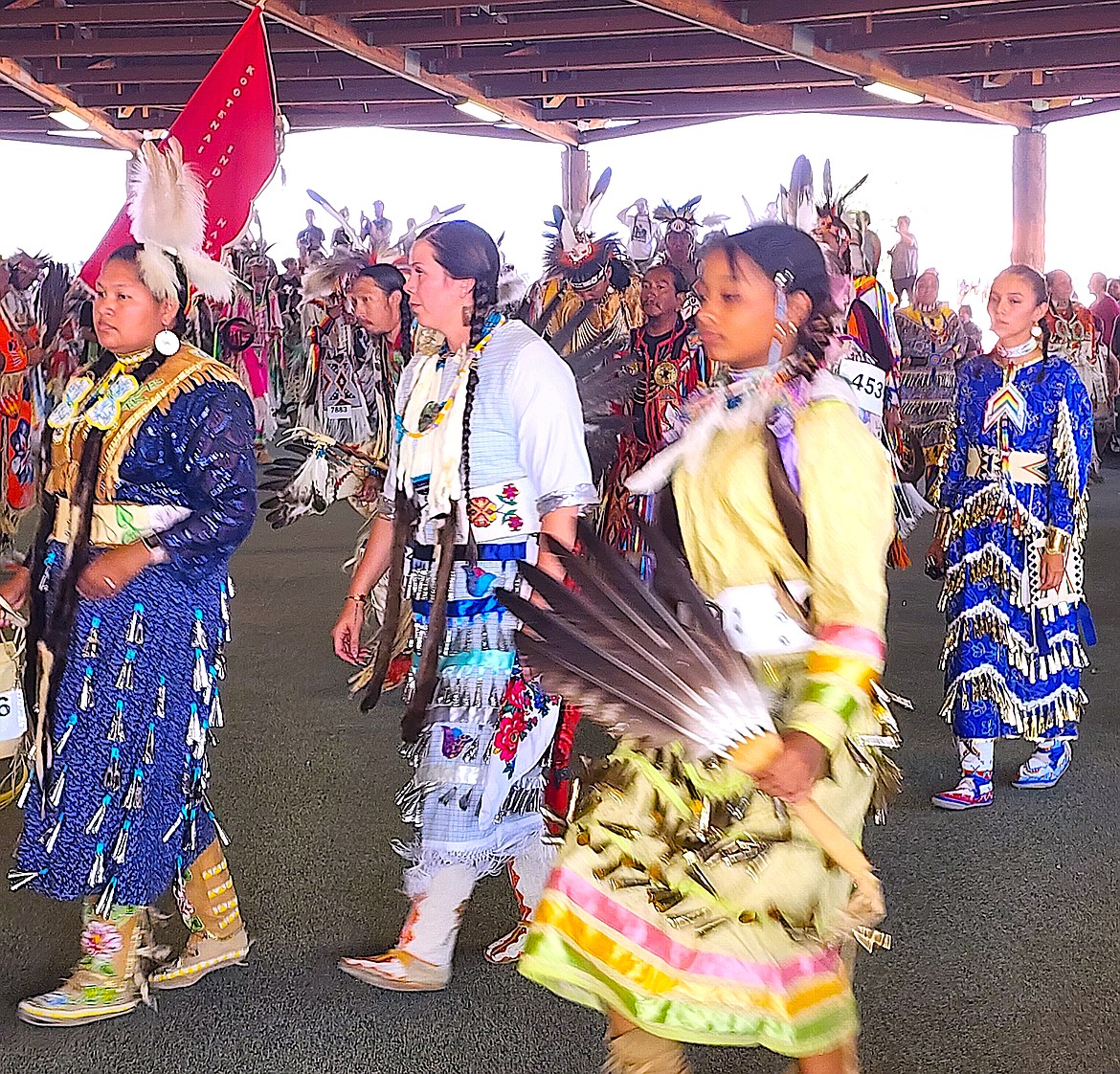 On a hot day, jingle dancers participate in the Grand Entry at 7 p.m. on Saturday evening. (Berl Tiskus/Leader)