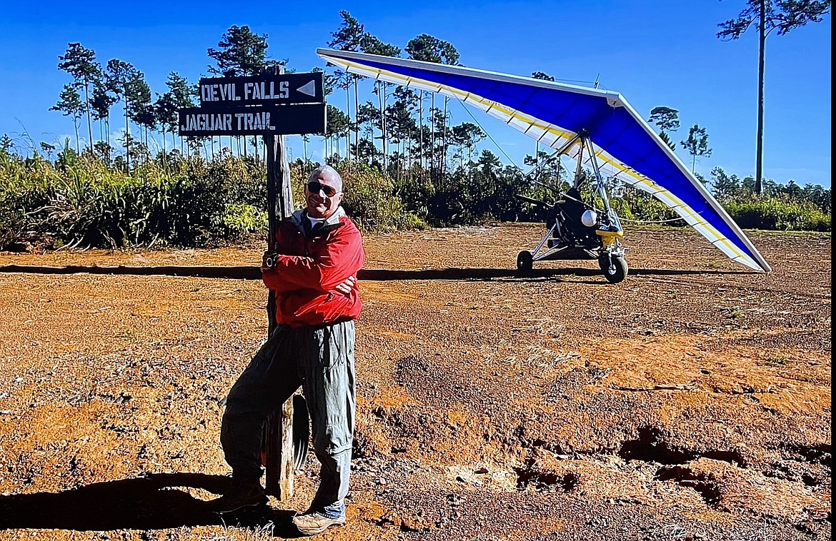 Robert Combs in Belize with his trike in the background. (Photo provided)