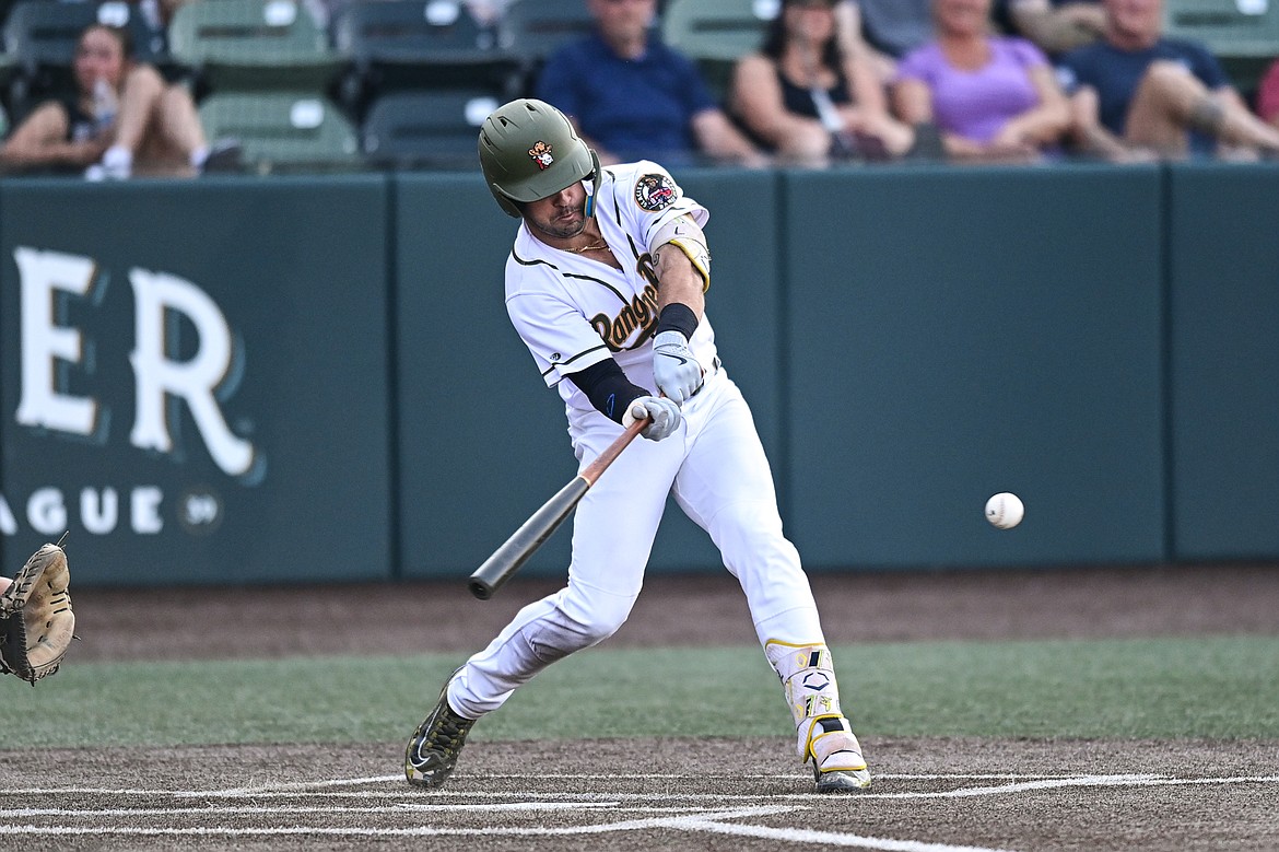 Glacier's Gabe Howell (10) connects on a single in the fourth inning against Boise at Glacier Bank Park on Tuesday, July 23. (Casey Kreider/Daily Inter Lake)