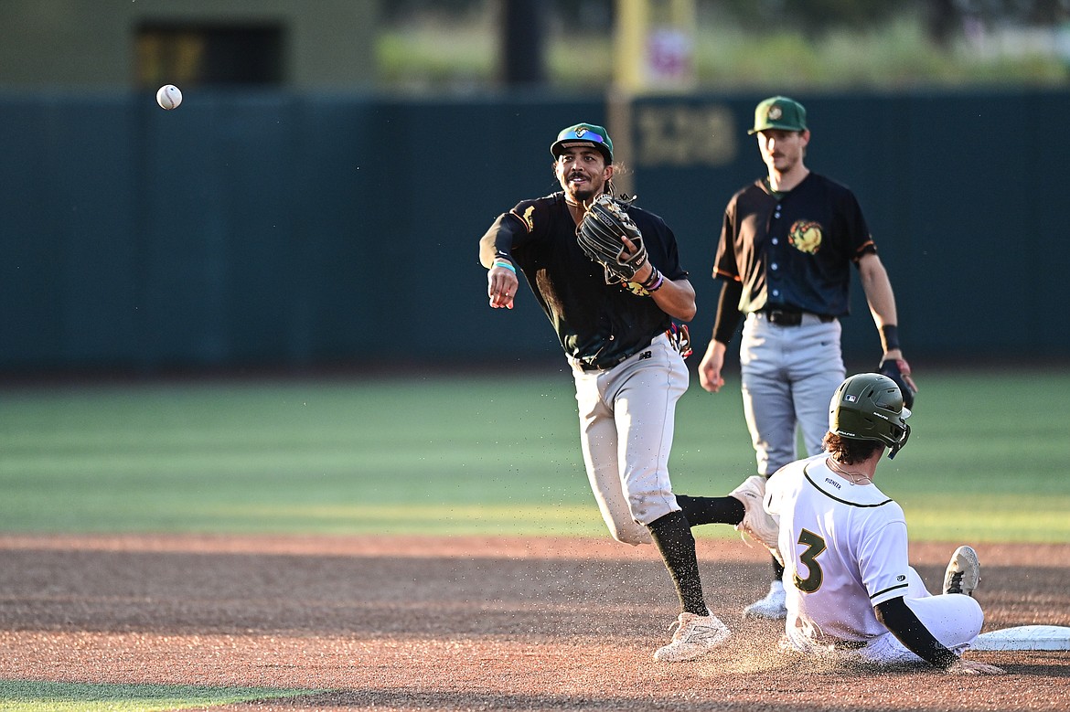 Boise second baseman Bubba Thompson (38) turns a double play in the fifth inning against Glacier at Glacier Bank Park on Tuesday, July 23. (Casey Kreider/Daily Inter Lake)