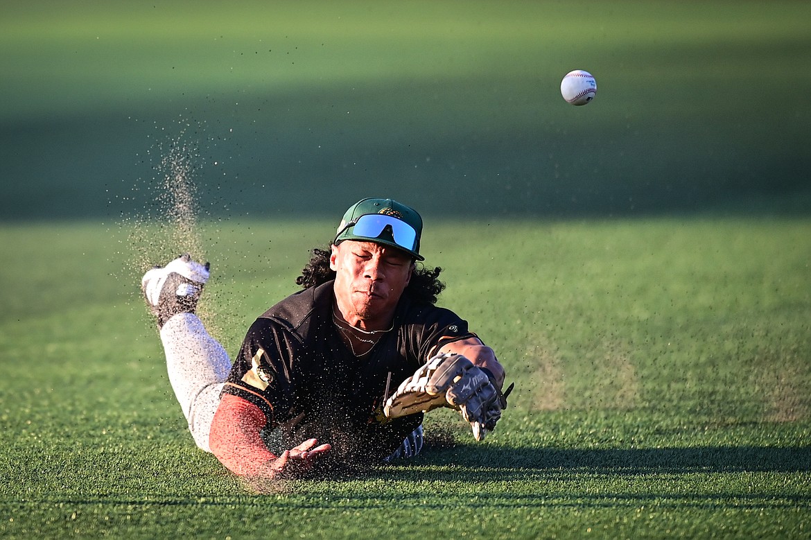 Boise right fielder Noah Marcelo (25) can't come up with a diving catch in the fifth inning against Glacier at Glacier Bank Park on Tuesday, July 23. (Casey Kreider/Daily Inter Lake)