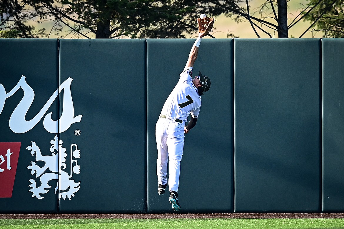 Glacier centerfielder JD McLaughlin (7) makes a leaping catch at the warning track to rob Boise's Michael O'Hara in the first inning at Glacier Bank Park on Tuesday, July 23. (Casey Kreider/Daily Inter Lake)