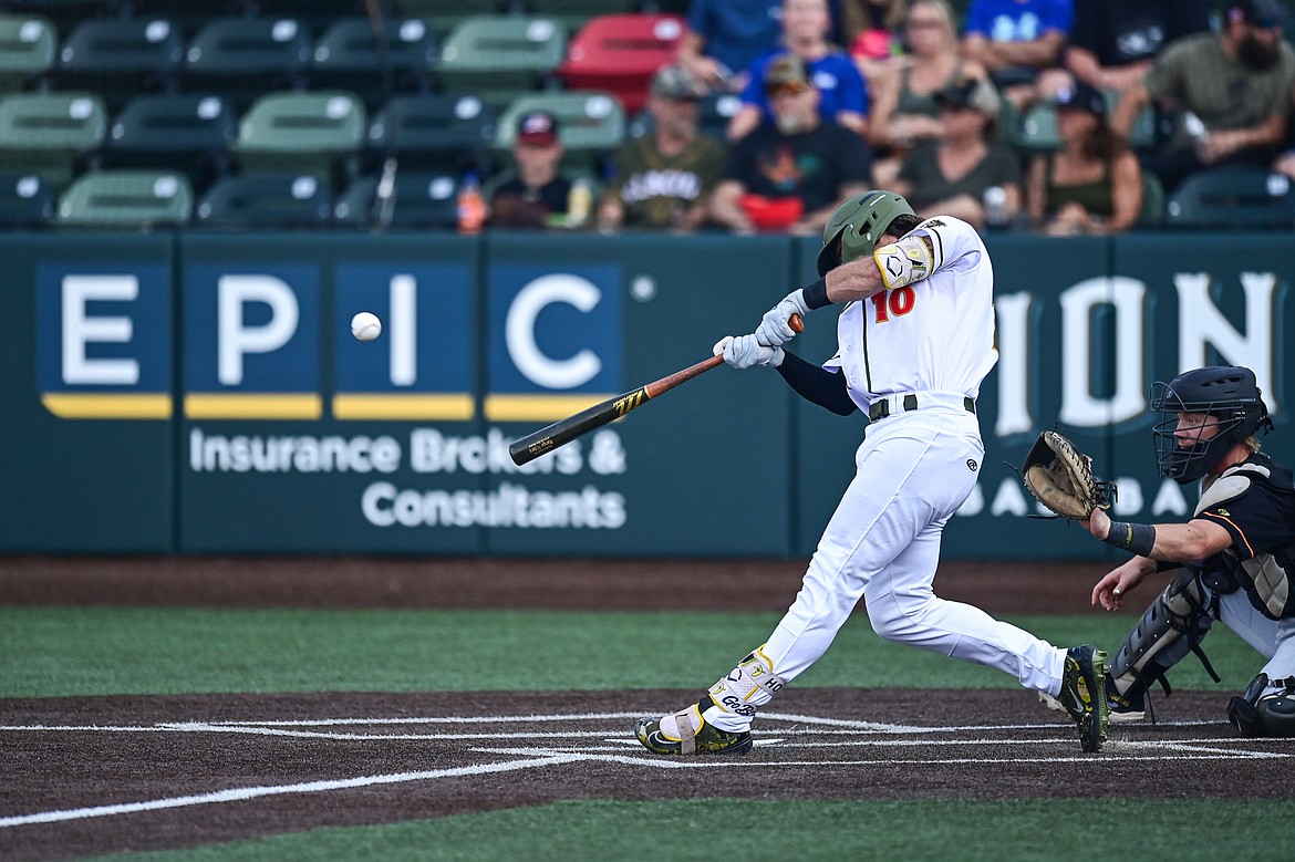 Glacier's Gabe Howell (10) connects on a single in the first inning against Boise at Glacier Bank Park on Tuesday, July 23. (Casey Kreider/Daily Inter Lake)