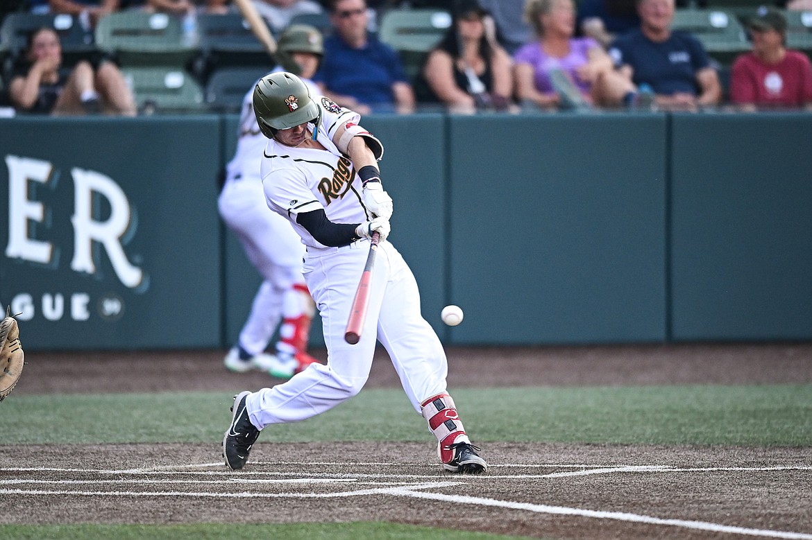 Glacier's Christian Kirtley (1) connects on a double in the fourth inning against Boise at Glacier Bank Park on Tuesday, July 23. (Casey Kreider/Daily Inter Lake)