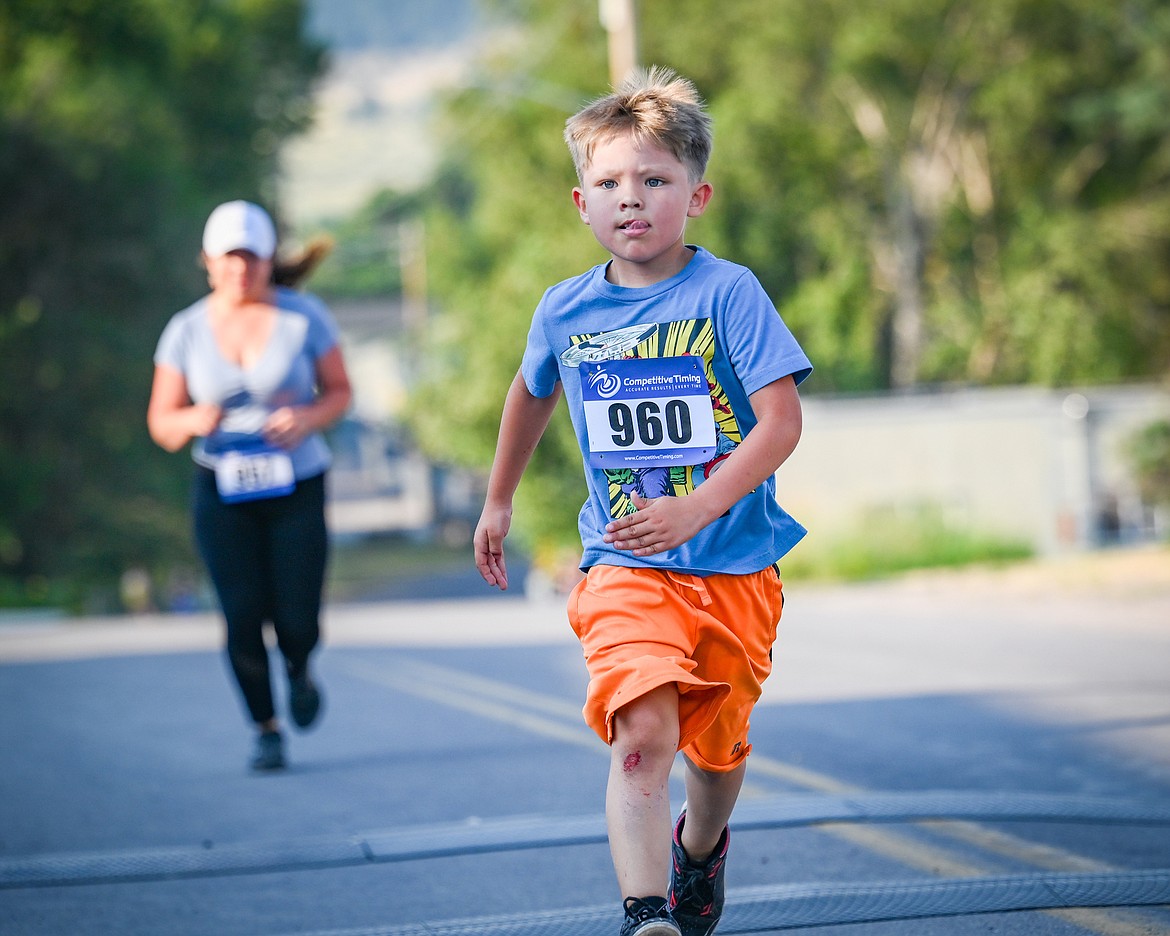 Young runner makes progress on the one-mile run/walk during Saturday's annual Buffalo Run in St. Ignatius. (Christa Umphrey photo)