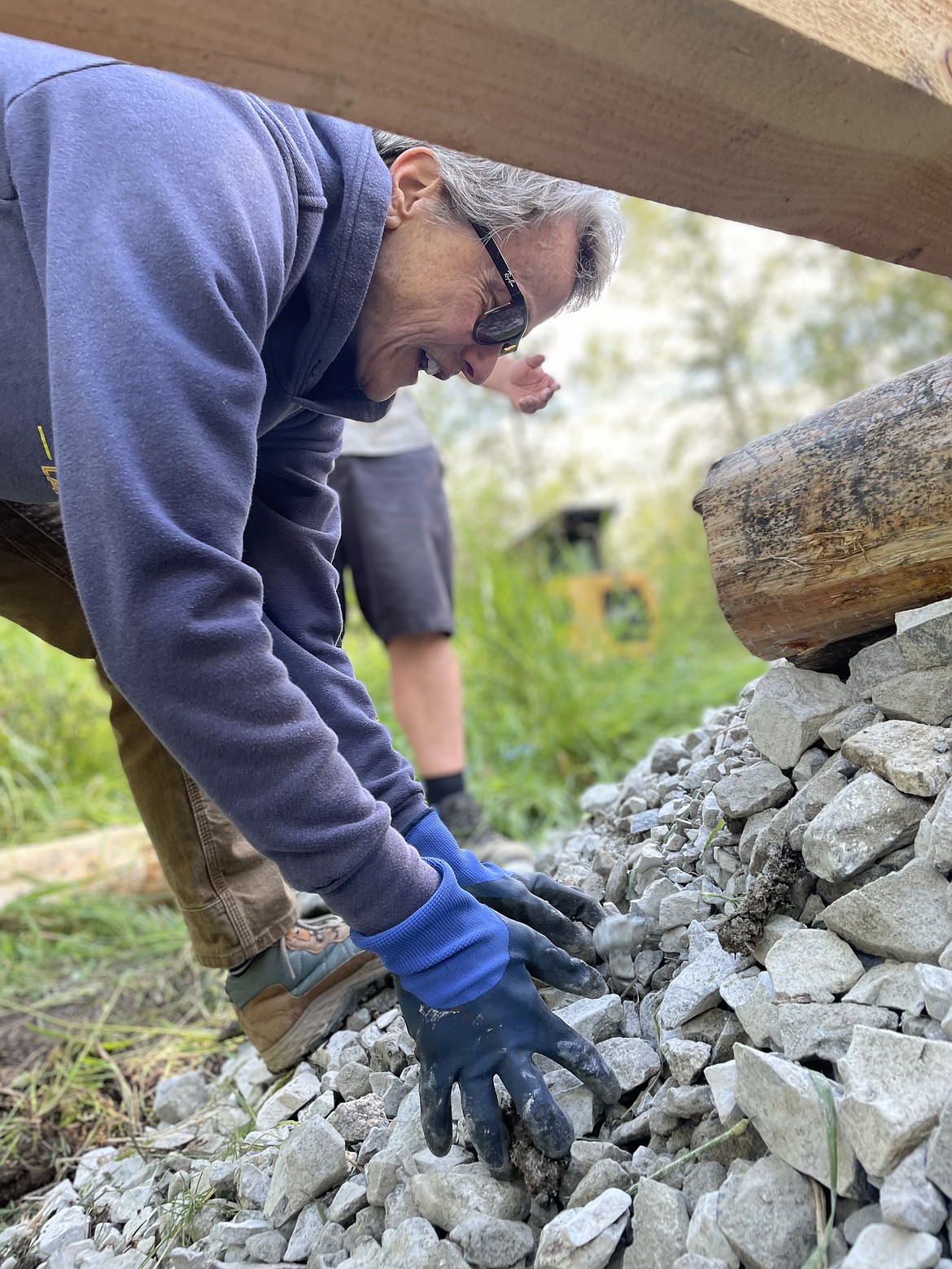 A volunteer works on the Kootenai Elementary "rewilding" project. The project is one of three in the Lake Pend Oreille School District to rewild elementary school play yards and reintroduce natural landscapes at school grounds.